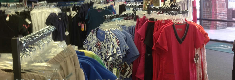 Store aisle with scrubs and accessories at Simply Uniforms