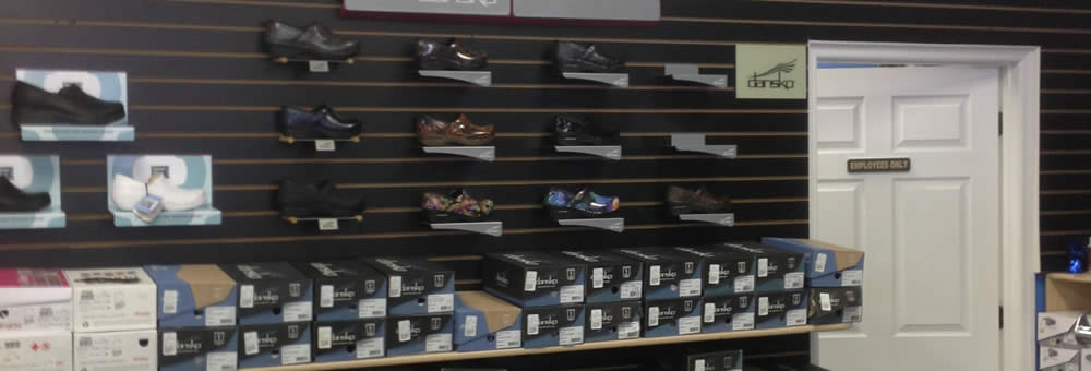 Shop floor at Simply Uniforms showing uniforms and accessories